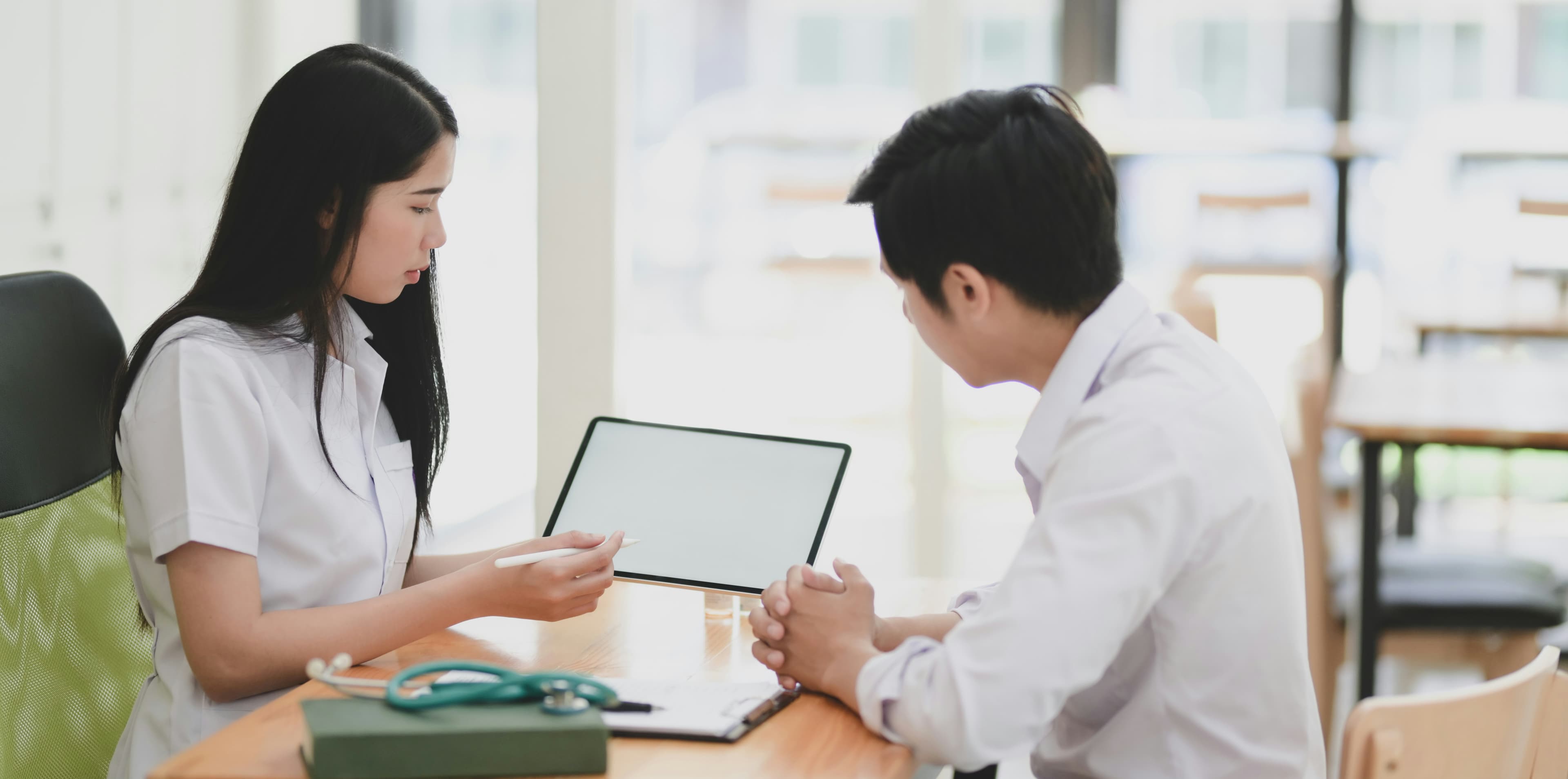 Two professionals discussing care options