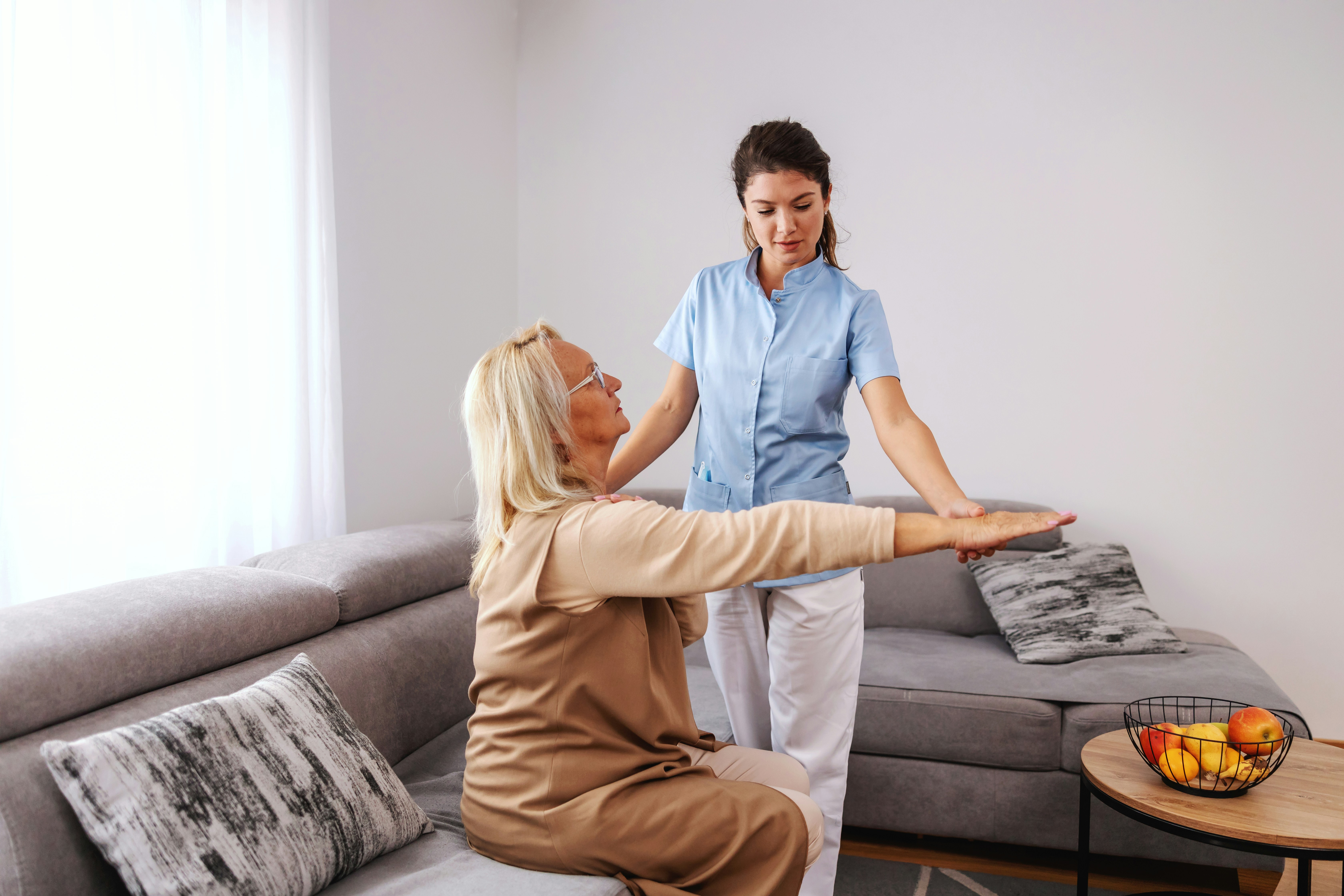 A support worker assisting a client in their home