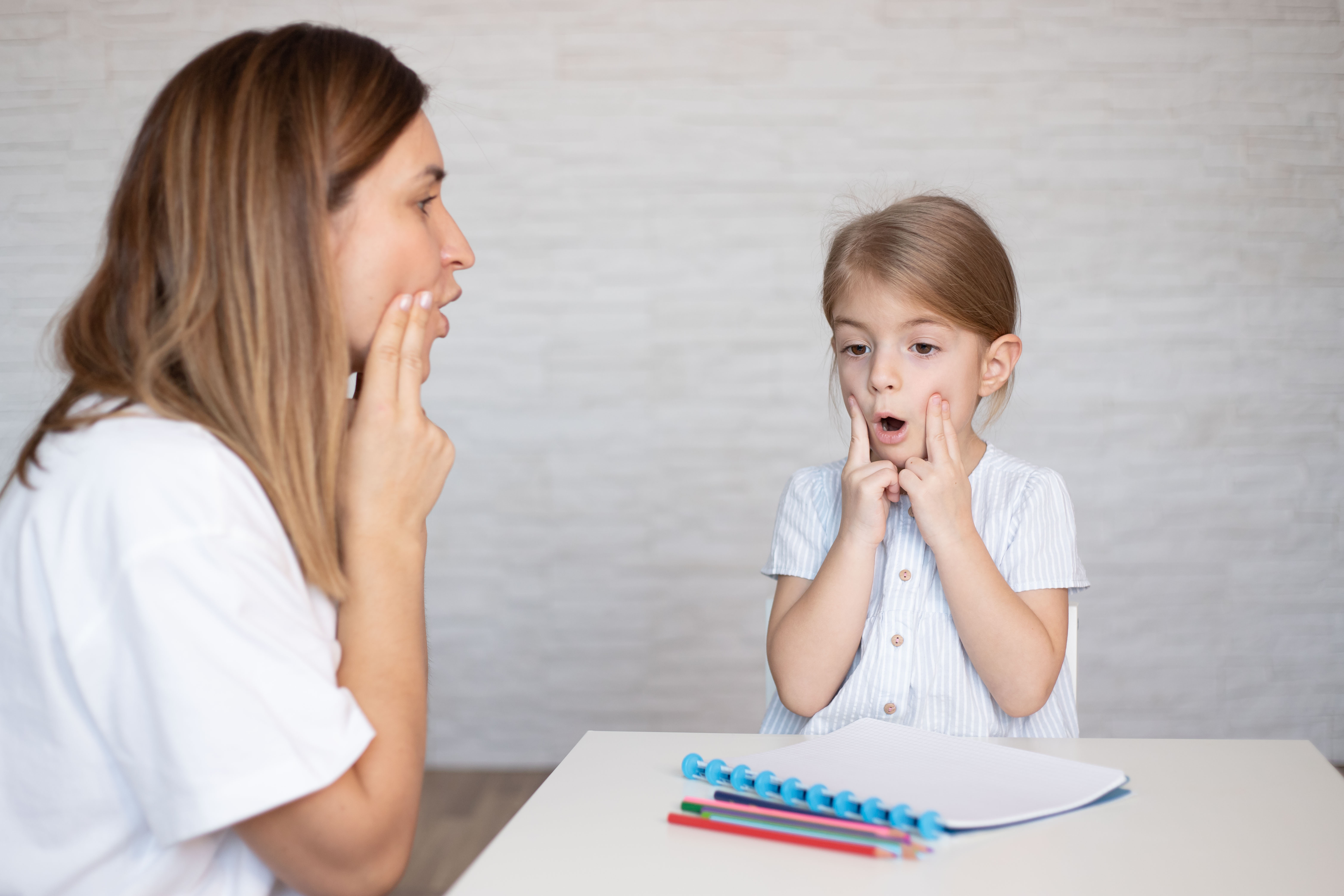 Speech pathologist working with a child